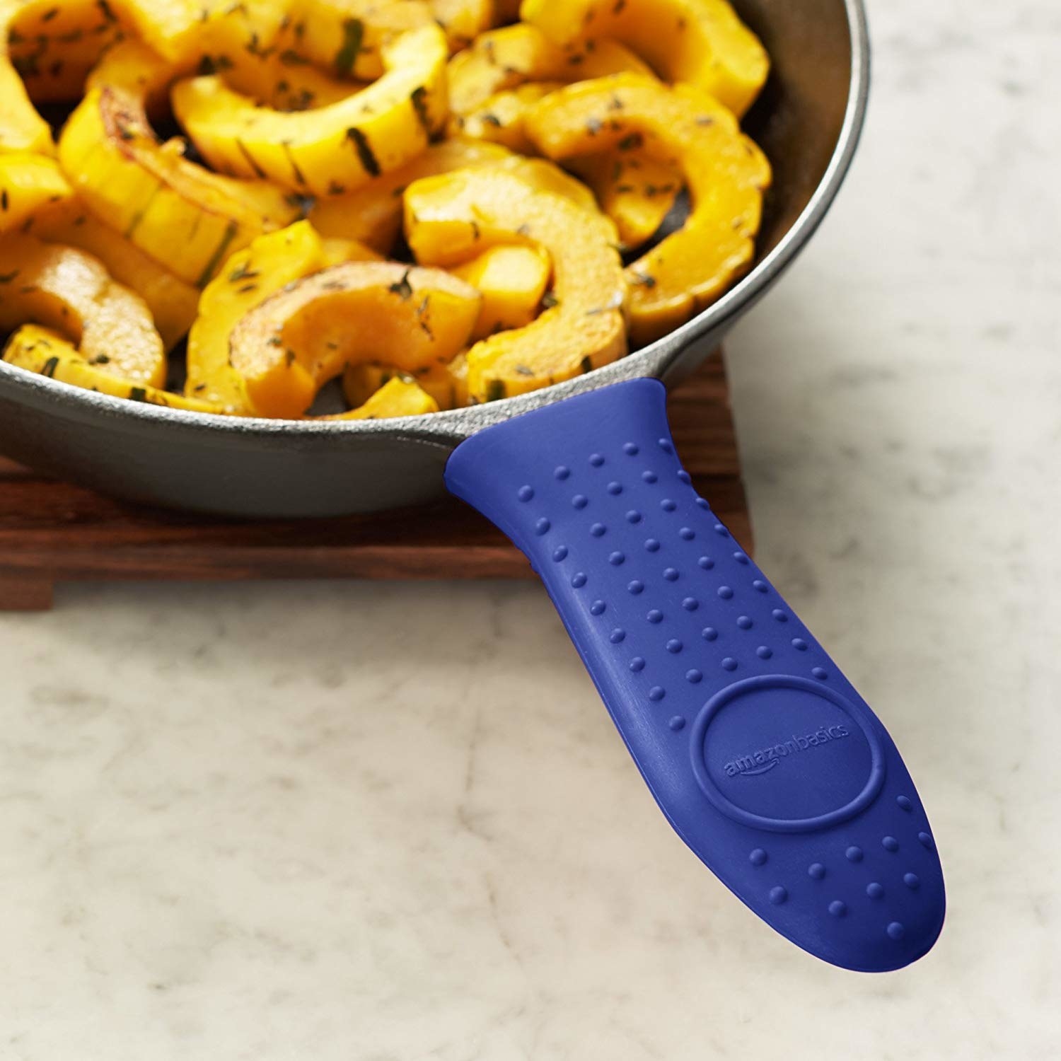 silicone cap in blue over skillet handle