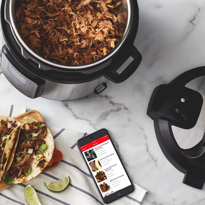 pulled chicken cooking in an Instant Pot on a kitchen counter