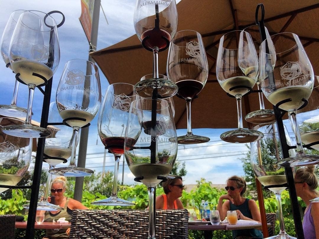Now with two locations in Virginia, Mermaid Winery upholds its vision of producing small batch, quality wine using grapes sourced from vineyards in Virginia and California. Try one of the Wine Flight options (five 1 oz tastings) or opt for a full glass of your favorite. Mermaid Winery also serves full menu, with delicious items like Beet Salad featuring red and gold beets, creamy burrata, micro green, and candied pecan in honey walnut vinaigrette.