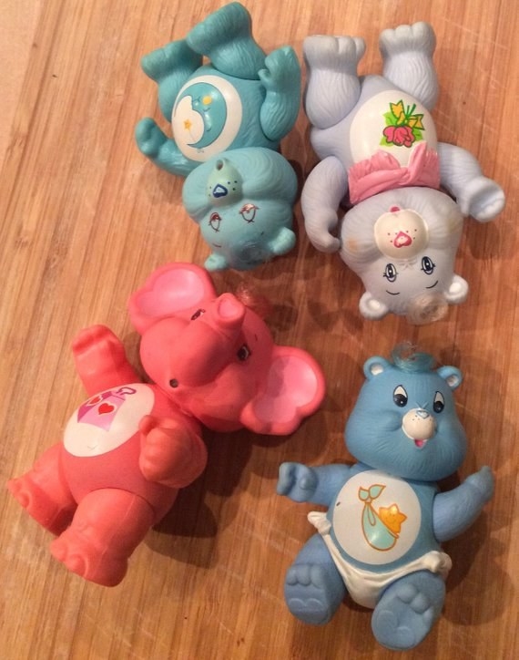 Five Care Bear PVC figures on a table