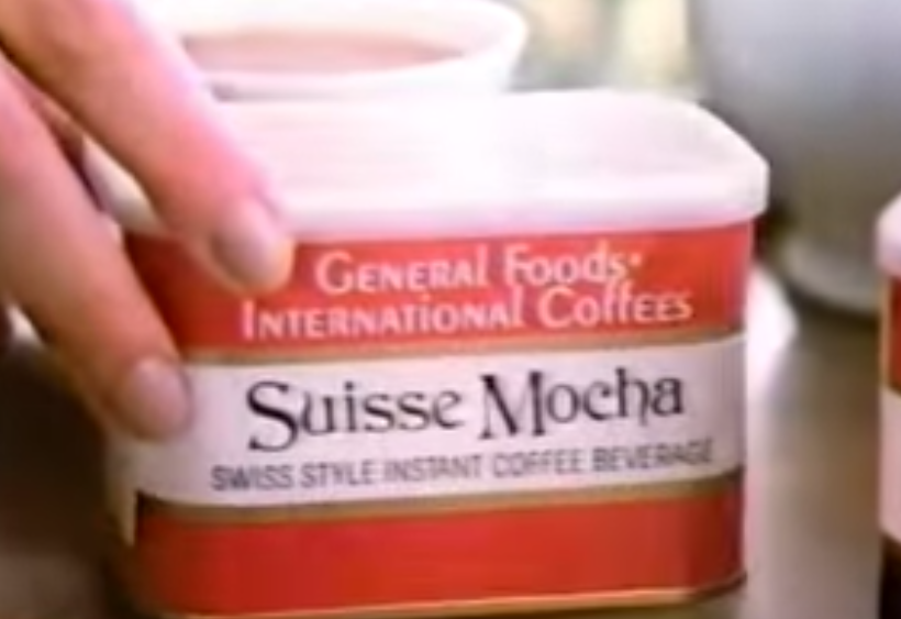 Screenshot of a hand holding Suisse Mocha flavored coffee