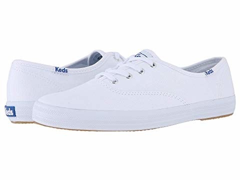 A pair of white canvas Keds