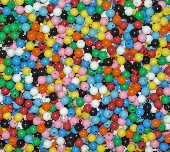 A pile of multiply color snap beads