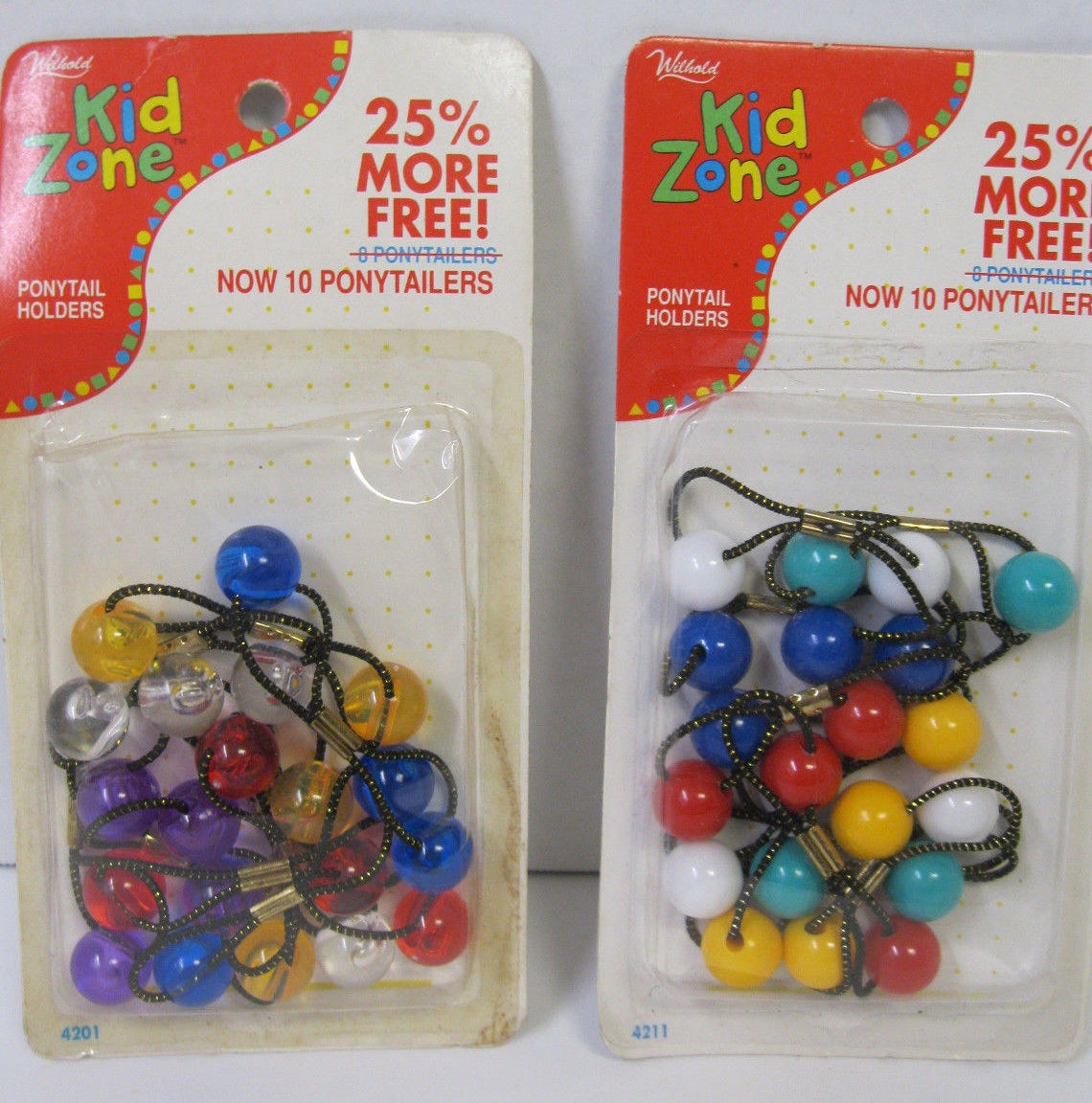 Two boxes of ponytail holders from the 1980s