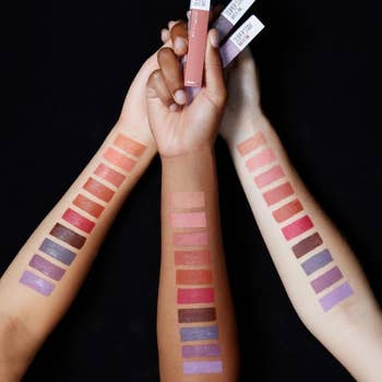 Three arms with color swatches showing the varies looks on three different skin tones