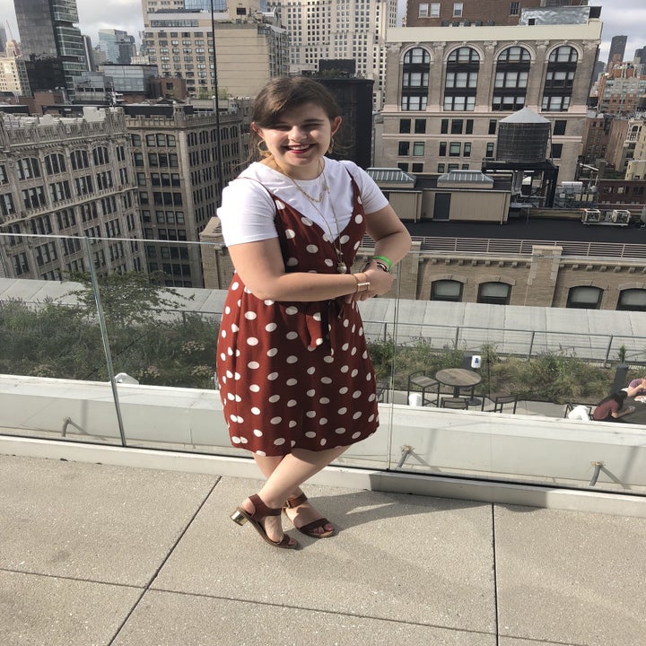 BuzzFeed Editor wearing the shirt under a red spaghetti strap dress with white polka dots