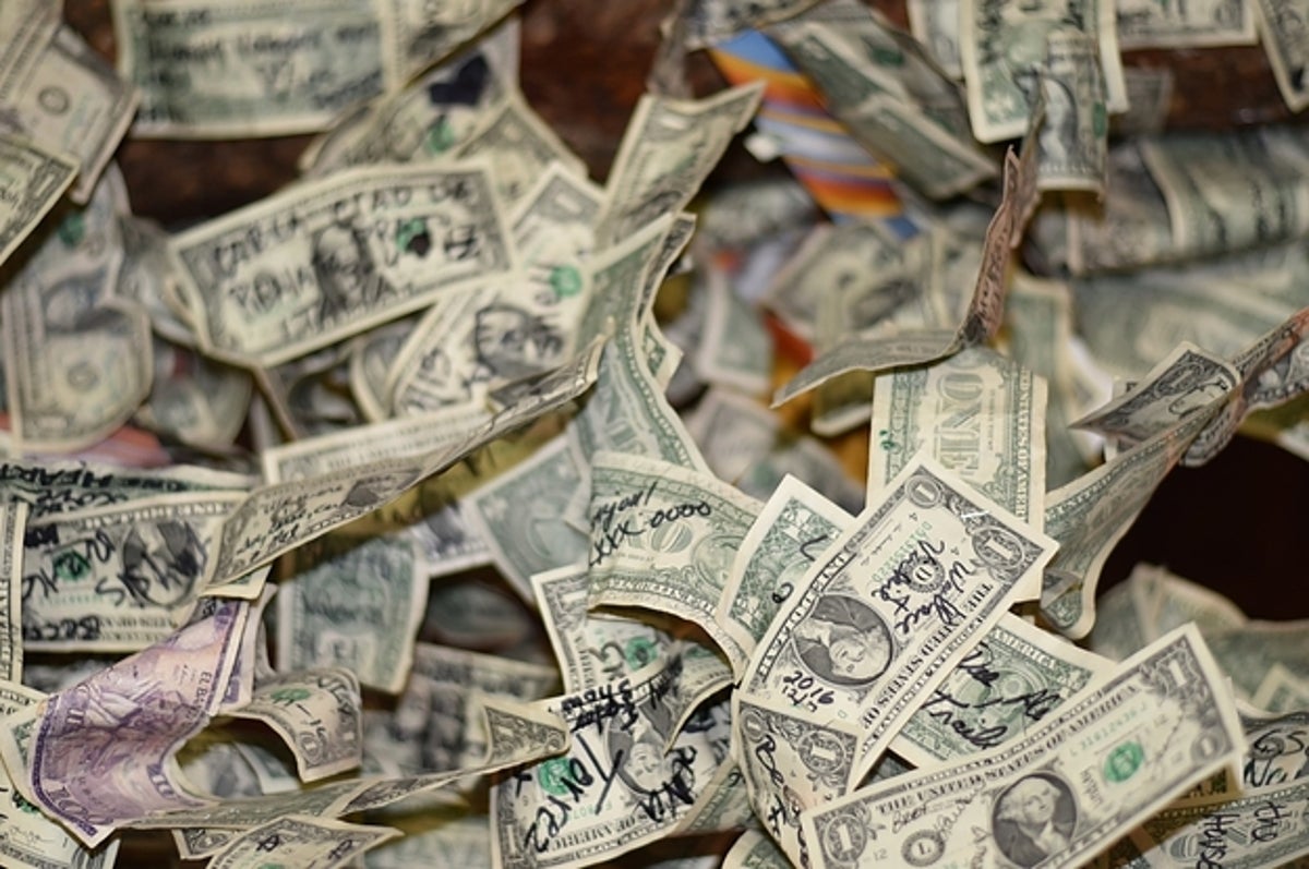 Man hiding money in jar of rice indoors, closeup. Financial savings Stock  Photo