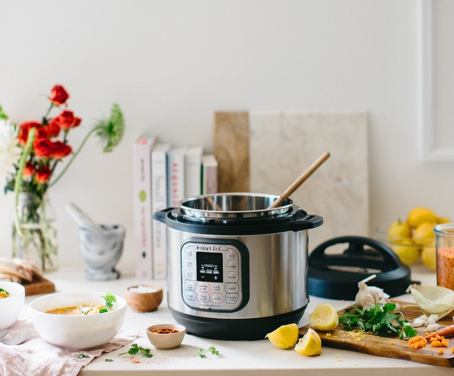 The Insta Pot with silver outside and black base and handles with an interface on the front