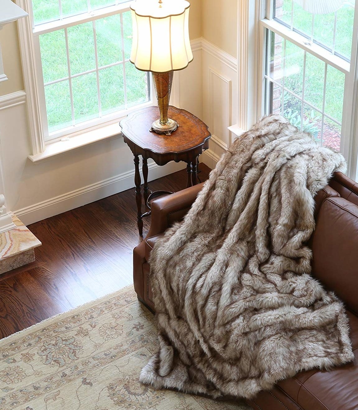 The brown furry blanket draped over a couch