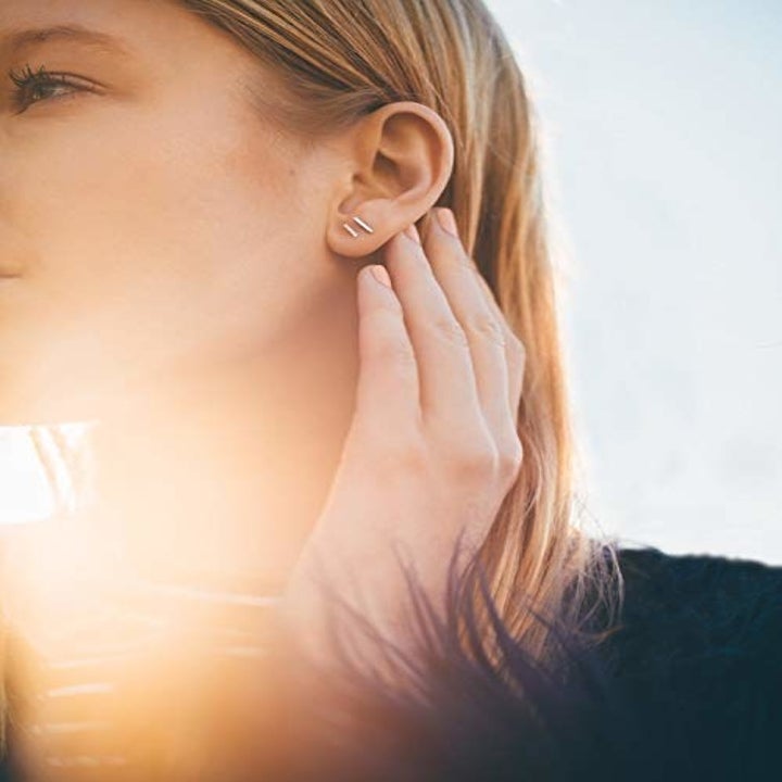 Model wearing the O-style earrings with crystal accents