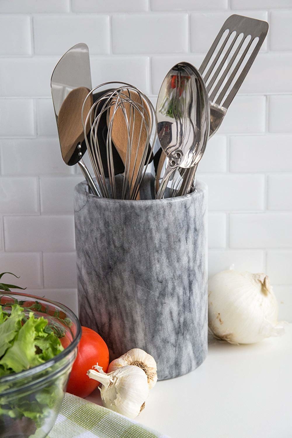 The marble option holding at least 7 large cooking utensils 