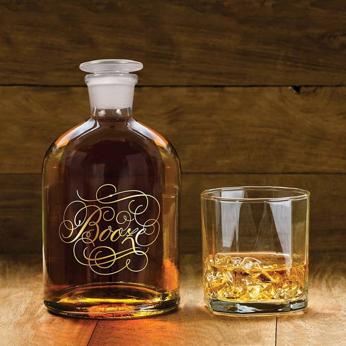 Glass decanter with the word &quot;booze&quot; printed on it in gold script with lots of flourishes