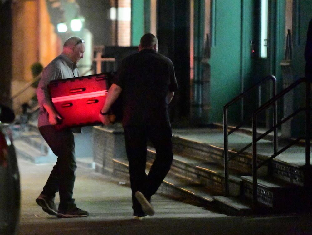Taylor Swift allegedly being carried to her apartment in a suitcase at night
