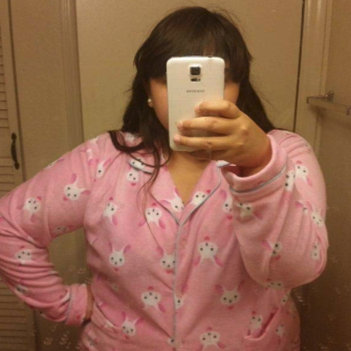 a reviewer in pink pajamas with bunnies on them