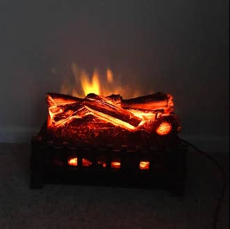 the realistic looking fireplace logs lit up