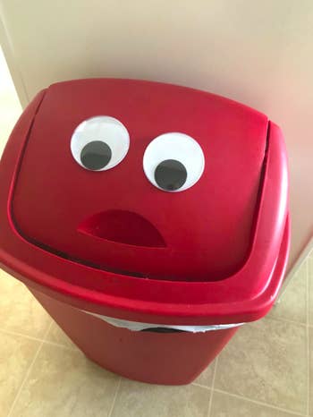 trashcan with big googly eyes