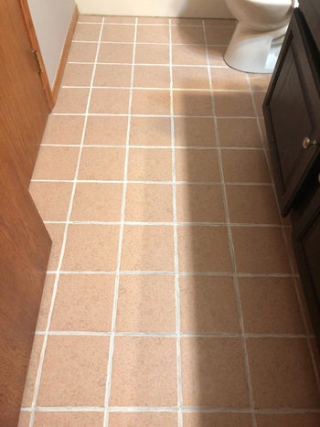 Reviewer photo showing the same tiles after using grout ink pen