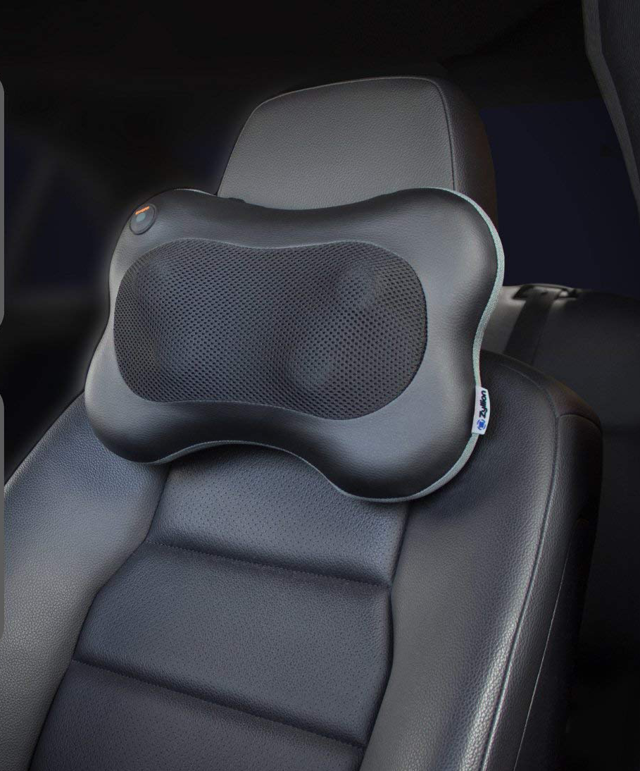 A pillow massager attached to car seat 