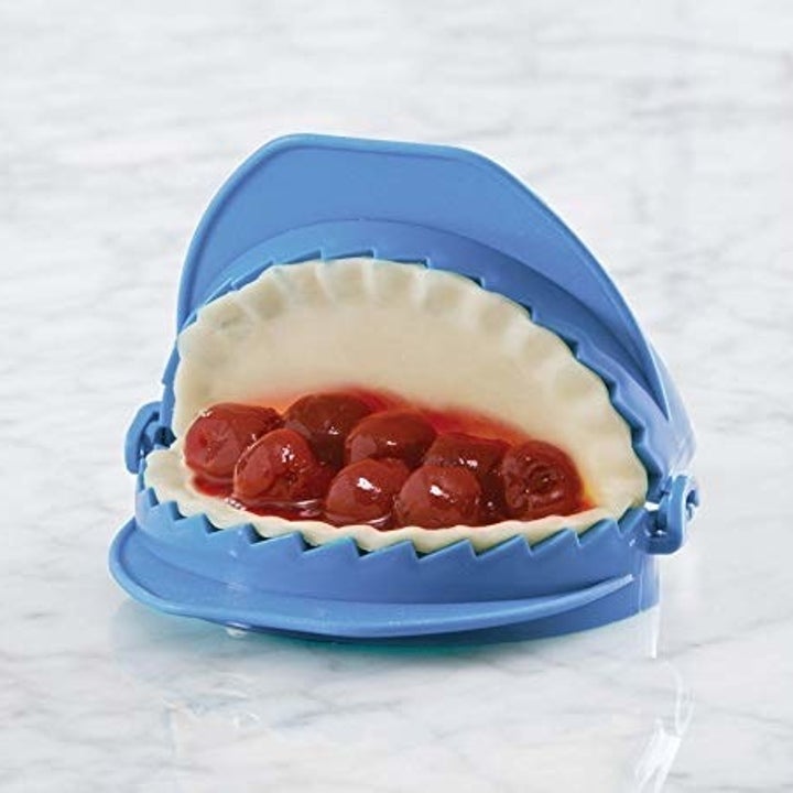 Tiny empanada inside dough press