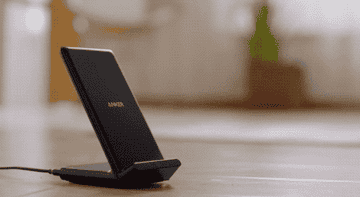 Gif of person placing phone on the charger 