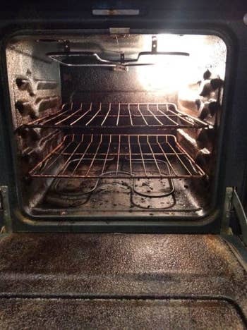 a reviewer's before photo which shows their oven dirty and rusty