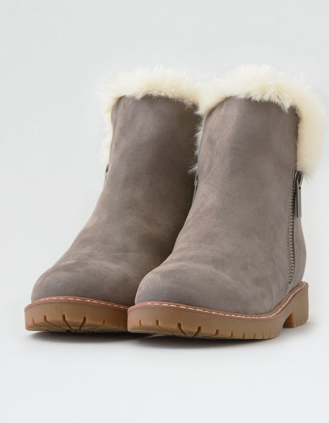 faux suede brown boot with zippers on the side and white shearling inner