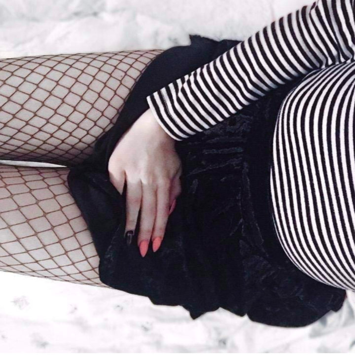 A reviewer wearing the skirt in black