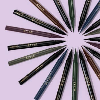 The eyeliner pens in black, dark green, dark blue, and plum
