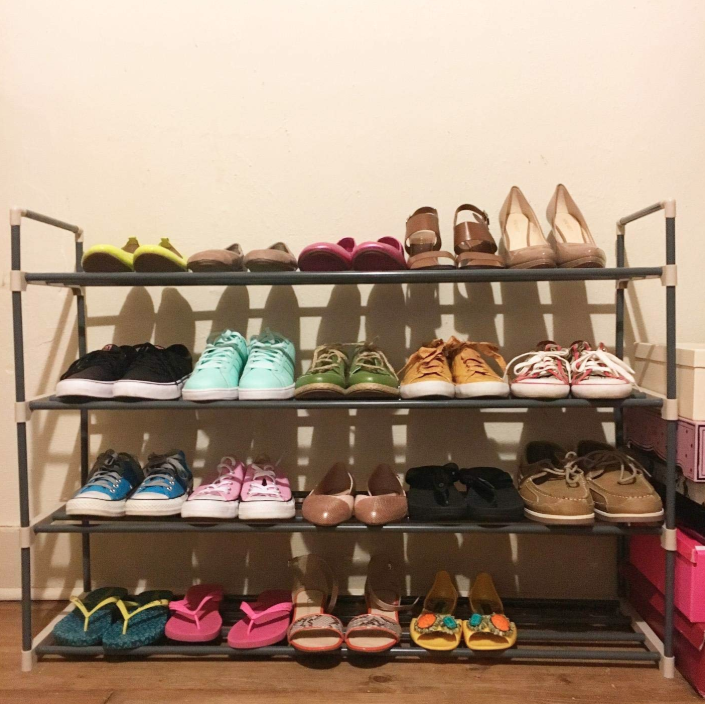 Reviewer's four-shelf rack with 20 pairs of shoes lined up on it