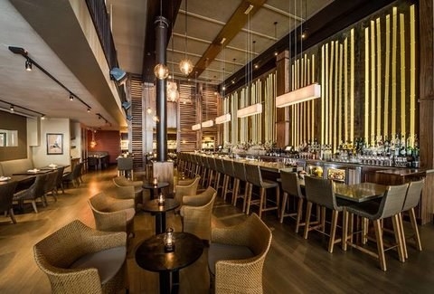 The trendy E&O Kitchen and Bar, located in San Francisco's Union Square neighborhood, specializes in Asian fusion cuisine with popular items like Indonesian Corn Fritters, Coconut Curry Ceviche, and Butternut Squash Dumplings, just to name a few. The beautiful interior boasts high ceiling with sleek, modern design that's perfect for a night out with friends, significant others, and more.