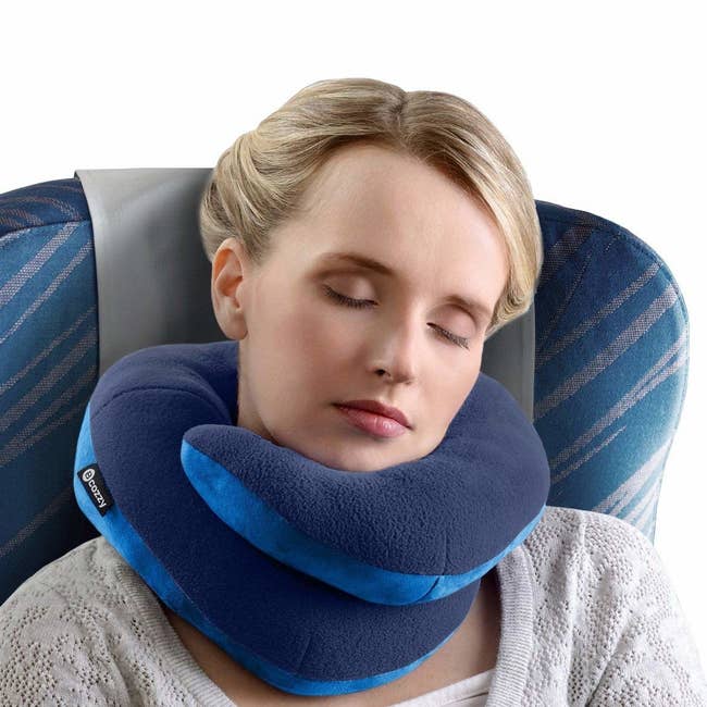 Model using the pillow on a plane, wrapped around their neck with a double layer in front