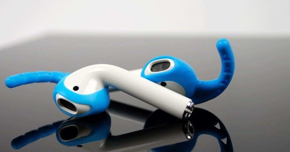A pair of Airpods with the blue hook grips attached