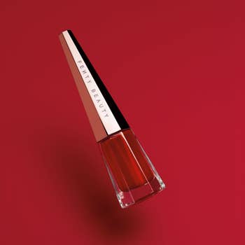 The elongated bottle of liquid lipstick