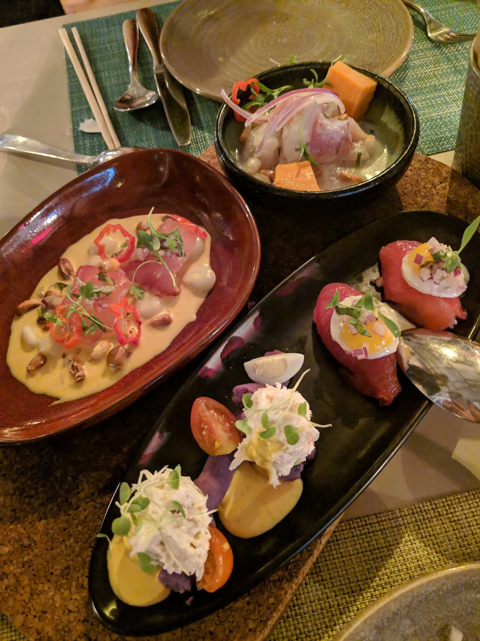 The first course starts with cold appetizers. The Clasico Cebiche features catch of the day (halibut) in classic leche de tigre with red onion, habanero, corn, and sweet potatoes. The Limena Causa highlights San Francisco's very own dungeness crab with avocado puree on top of mousse-like whipped purple potato and creamy aji amarillo sauce. The Ahi Tuna Nigiri is topped with quail eggs for that oozy, creamy yolk. Finally, the Tiradito La Mar is a creamy blend of aji amarillo sauce with fresh sashimi of tuna, corn, jalapeno, and micro greens.