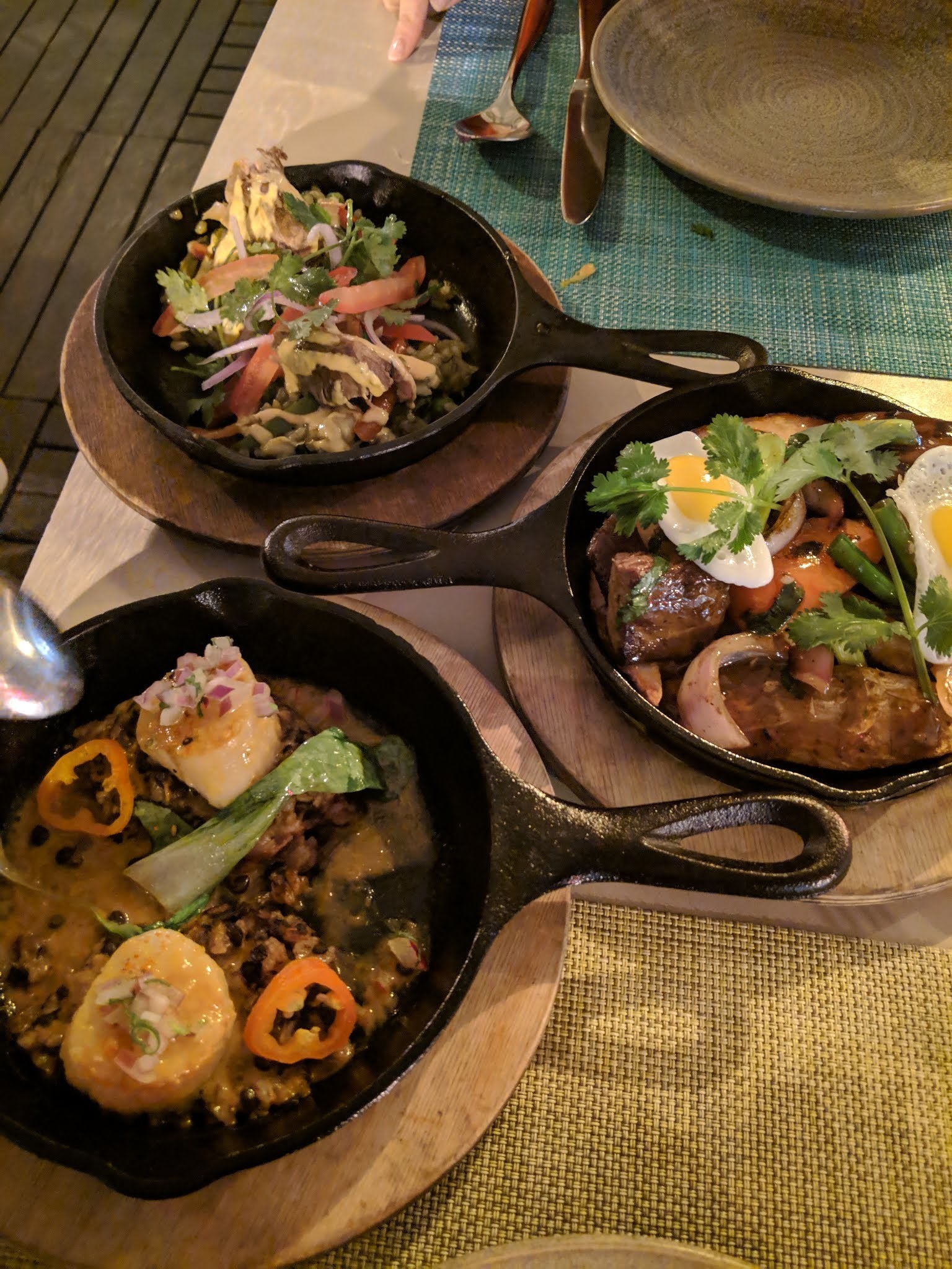 Served on skillets, the main course features three of La Mar's most popular entrees. Arroz Con Pato, literally translated as duck with rice, is a hearty dish of duck served on top of rice with vegetables. The other shareable dishes are Lomo Saltado, or traditional Peruvian style beef tenderloin with tomatoes, cilantro, and garlic flavored in soy and oyster sauce and served over a bed of potatoes and fried quail eggs, and Scallops in Aji Amarillo with black rice.
