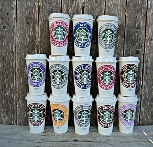 a stack of personalized starbucks hot cups