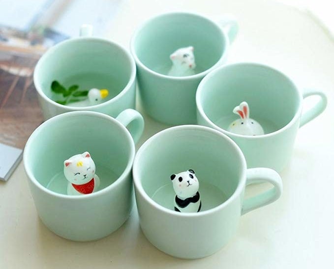 Five of the mint mugs, each with a different animal inside them: there&#x27;s a panda, cat, duck, tiger, and bunny