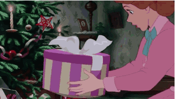 gif of Lady from the movie &quot;Lady And The Tramp&quot; getting taken out of a gift box