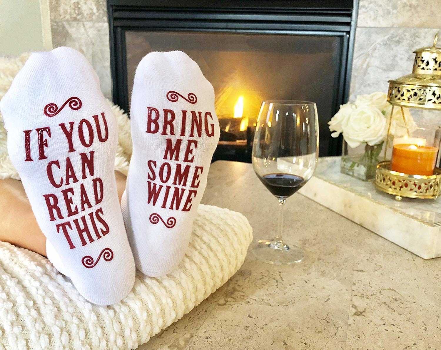 The socks that say "if you can read this" on one and "bring me some wine" on the other on the soles