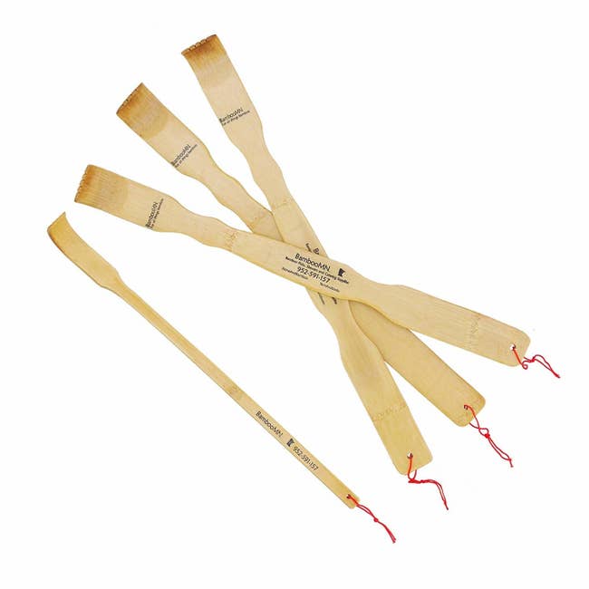 four bamboo back scratchers