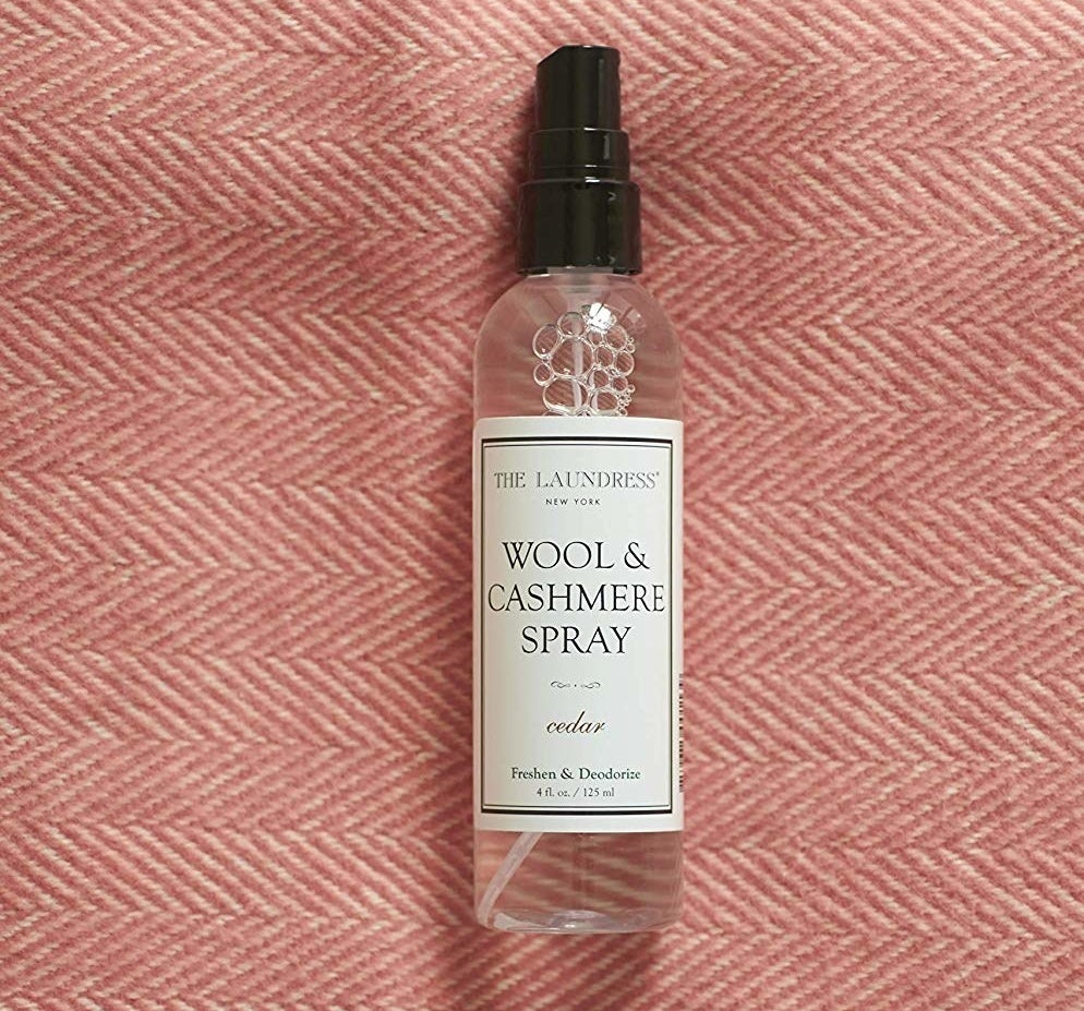 The bottle of The Laundress Wool &amp;amp; Cashmere Spray in cedar