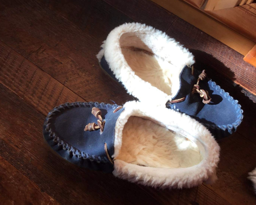 A reviewer&#x27;s pair of fleece-lined slipper loafers with a fresh set of the fuzzy insoles in them