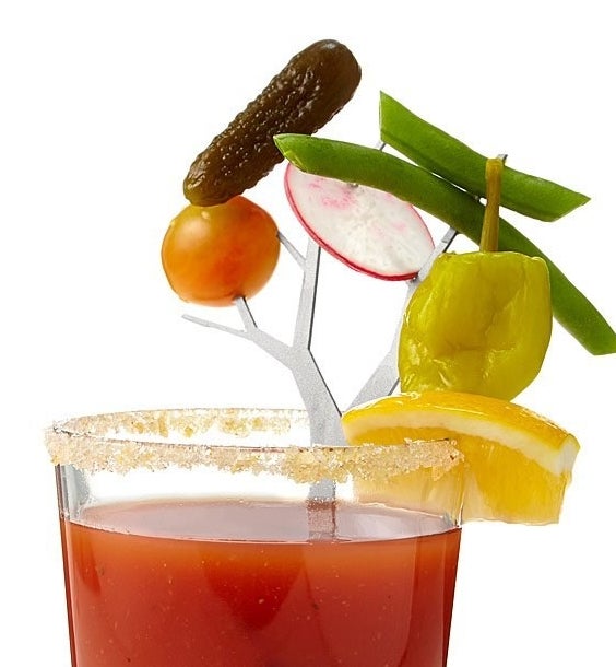 the cocktail branch in a bloody mary spearing different garnishes