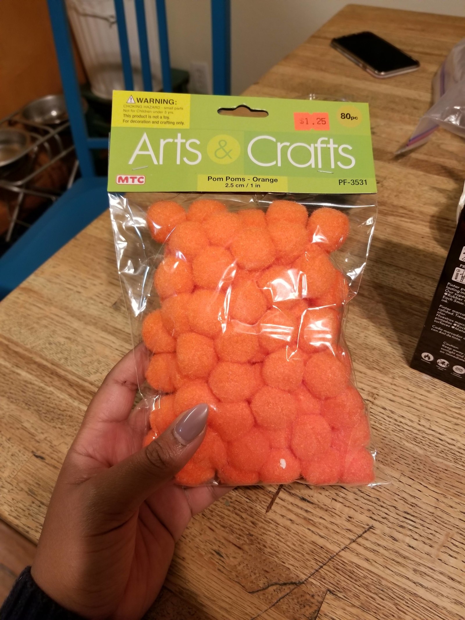 orange pom poms that look like cheese balls