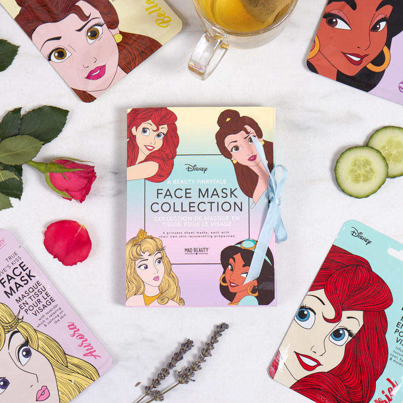 the Disney princess face mask collection from Firebox spread out and styled on a table