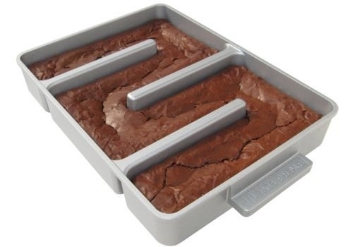 Pan will fit most standard box mixes without needing adjustments, plus the pan is one continuous chamber to make spreading batter easy. It features a durable non-stick coating and heavy gauge cast aluminum construction. It comes with a nylon spatula and brownie recipes for inspo!Promising review: "As I sit here eating yet another corner piece, I wonder to myself, why did I buy this pan? Between the pan and the great silicone lid that fits it perfectly, I spent money I did not need to spend. And I think it was a mistake. Before, I made brownies from scratch because I don't do the box mix thing, and my kids and husband ate them all. I would just trim off the edges here and there, eat the occasional corner piece, and enjoy the chewy goodness. But now, after trying out this pan, here I sit, eating like half the brownies I made. Smooth move. This is the same recipe I always make in a 9"x13" pan, and it fit perfectly into this pan. I greased and lightly floured the pan, and the brownies just pop right out, using the cute little spatula that comes with it. But you know what will NOT be cute and little? Me, thanks to this pan. These are hands-down the most delicious brownies I have ever made. I thought about buying this pan a few years ago, and just didn't, but I should have — it worked perfectly." —Bailey's momGet it from Amazon for $35.95 (originally $39.95).