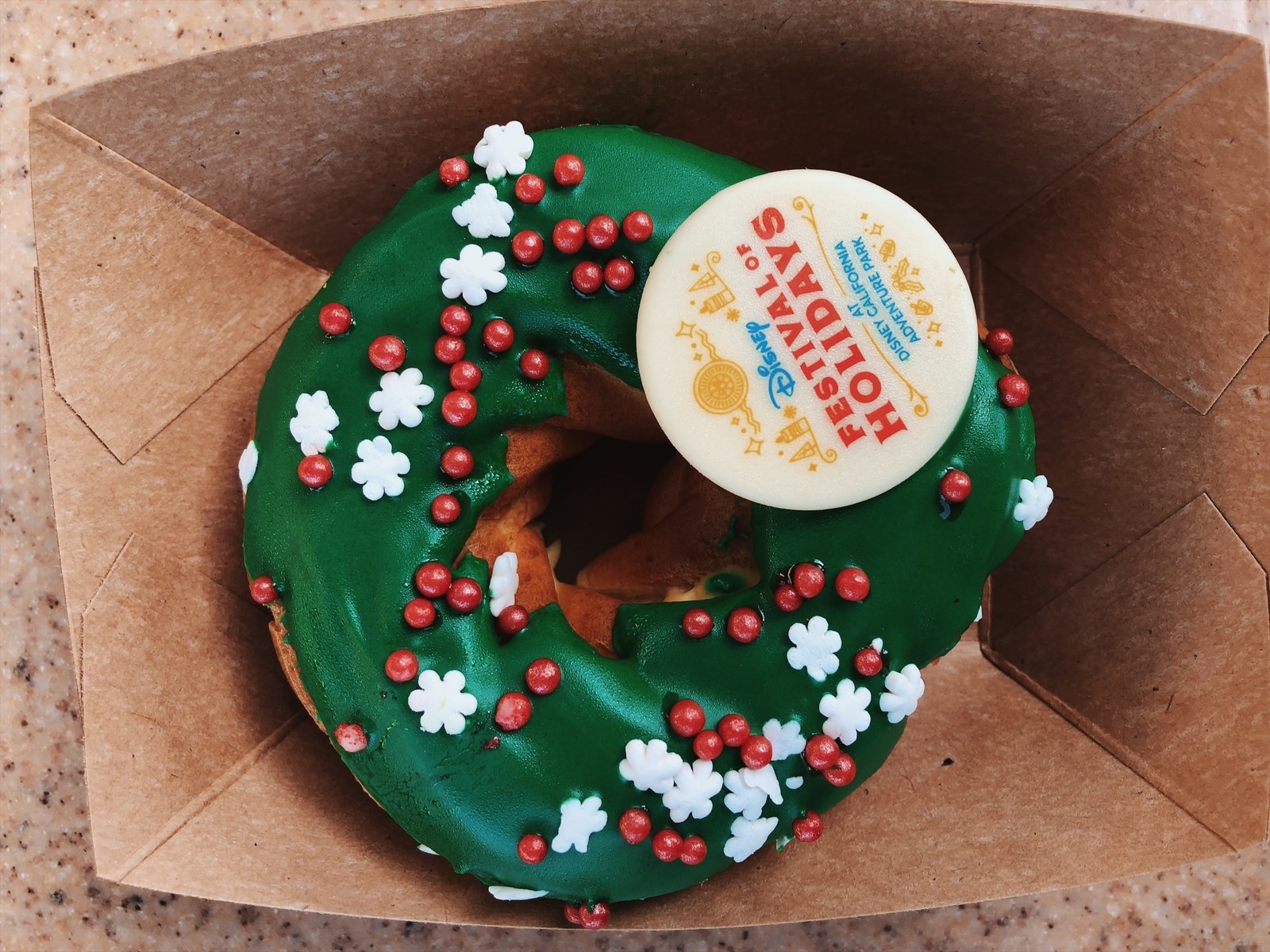 Where you can get it: Visions of Sugarplums booth at the Festival of Holidays. Why it's so good: So this looks like your standard donut (with just a festive icing on top), but it's far from that! Once you bite into it you get a nice eggnog flavored filling, also the icing coating it is made of white chocolate! It's really something you can enjoy early in the morning with coffee! Get it if: You like eggnog!
