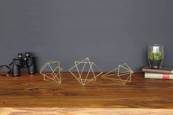 the gold wire decor on a table 