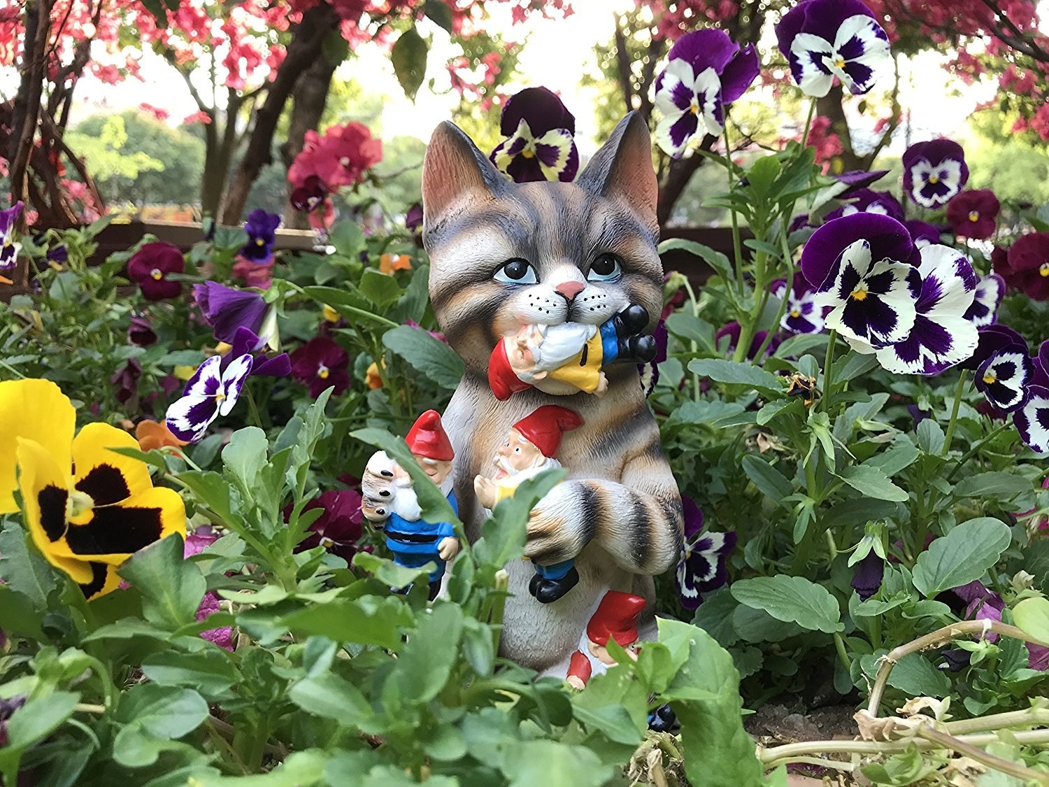 Promising review: "Bought this for my mother — she loves cats and hates lawn gnomes so it was a perfect gift for her! It arrived as scheduled in great condition. I was pleased to see the quality of the product far exceeded my expectations. Sometimes you order things online and it isn't quite like the picture states. My mom loved the gift and got a good laugh out of it! Definitely worth the money. Oh, and an added bonus, they reached out to me on a personal note (as I'm sure they do to most of their customers) asking how I was enjoying the product. Just goes to show what level of customer service they provide! I'm sure if I had an issue with the product they wouldn't think twice about helping to resolve it!" —AprilGet it from Amazon for $28.95 (available in three other designs for $19.95+).
