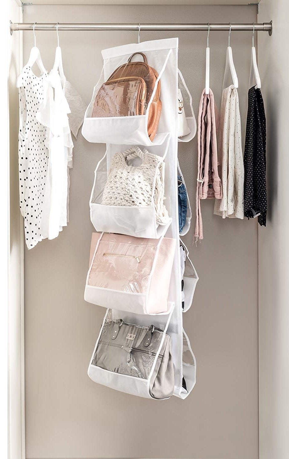 vertical purse organizer hanging in the closet